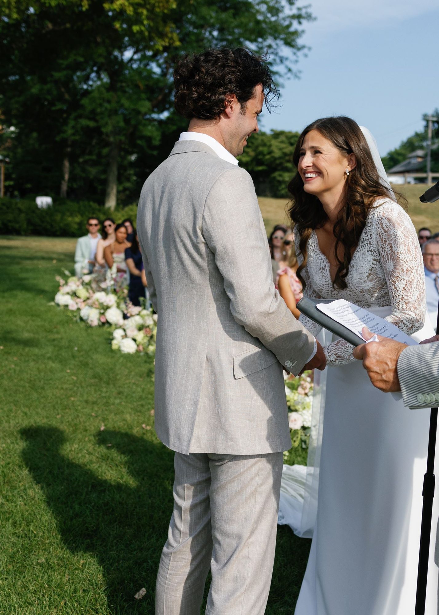A portrait of the newlyweds by the water.